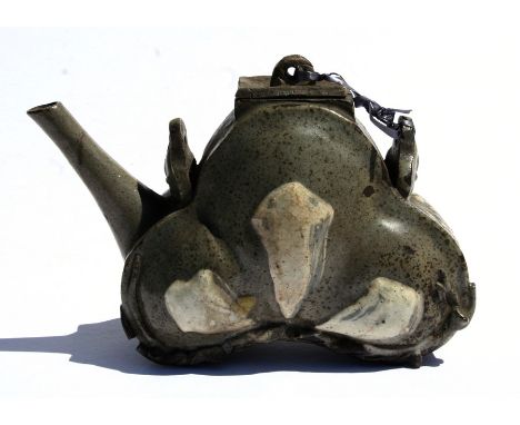 A Chinese glazed pottery teapot with impressed mark to the underside, 13cms (5ins) high.
