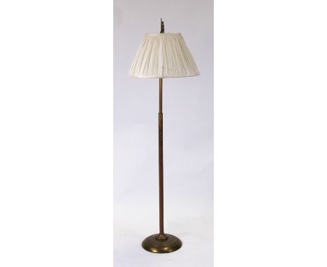 A brass reading or standard lamp, 149cms (58.5ins) high.