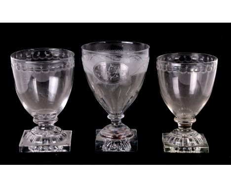 A 19th century etched glass initialled 'JHA' with lemon squeezer base, 15cms (6ins) high. together with two similar (3)Condit