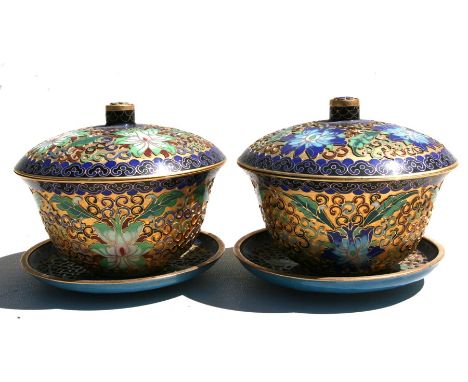 A pair of Chinese gilt metal and enamel bowls, cover and stands, 13cm (5ins) diameter.