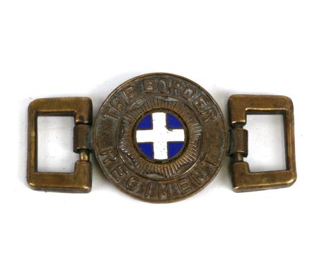 An unusual brass and enamel belt buckle to The Border Regiment. Overall width 6.5cms (2.5ins)