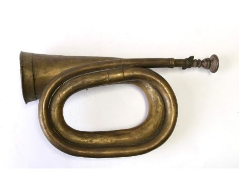 A 19th century Swedish military brass bugle with badge