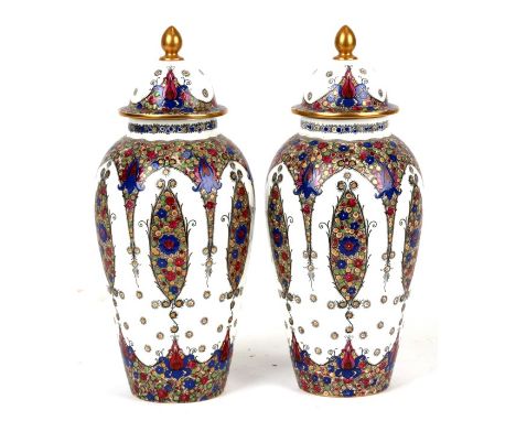 A pair of Royal Worcester vases and covers, pattern 2470, 24cms (9.5ins) high.Condition ReportCrazing to the glaze of both, o