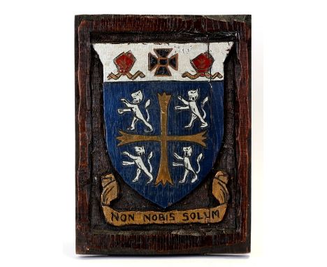 A painted oak panel carved with the heraldic arms of  University College (Durham University), 26cms (10.25ins) high.
