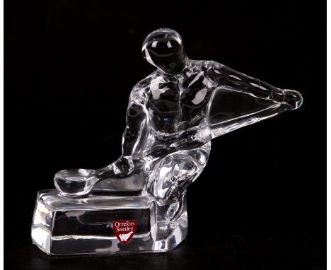 A Swedish Orrefors glass figure of an ice hockey player, 11cms (4.75ins) high.