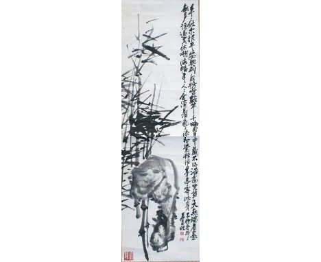 A Chinese scroll painting depicting bamboo and calligraphy and seal marks, 36 by 127cm (14 by 50ins). 