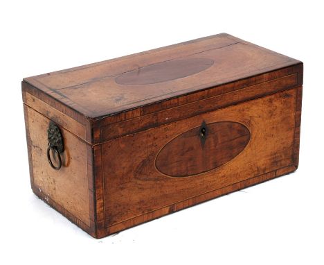 An early 19th century mahogany tea caddy with lion mask handles, 30cms (12ins) wide.