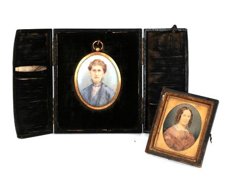 A late 19th century oval portrait miniature depicting an old lady, cased; together with an overpainted military photograph (2