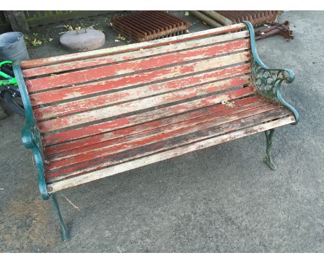 A garden bench with cast sides.