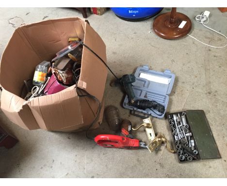 A box containing various tools including a dremel.