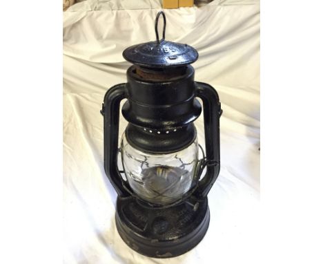 A hurricane lamp.