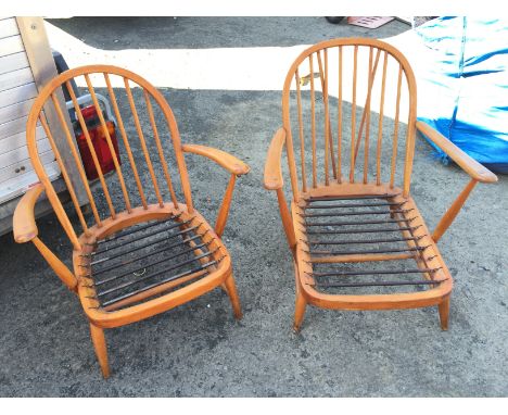 A pair of Ercol armchair frames.