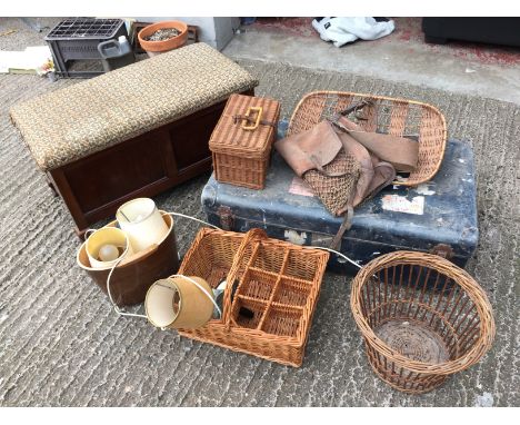 A lot consisting of wicker baskets a trunk, otterman and a game bag.