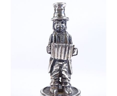 A novelty Spanish silver miniature statue, depicting figure playing a concertina, height 10.5cm, 2.8oz 
