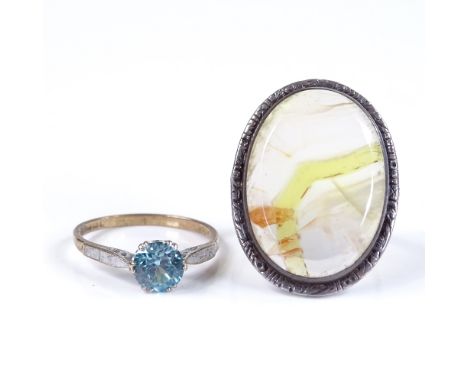 A 9ct gold single stone blue zircon ring, size O, together with a silver and agate panel ring, size M (2) 