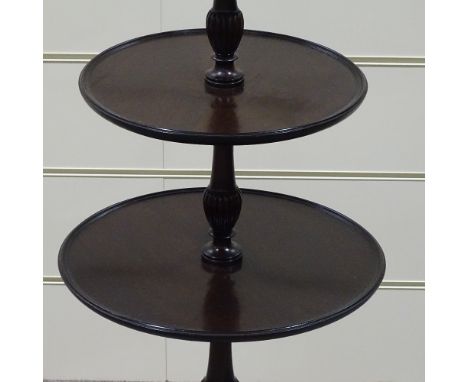 A circular mahogany 3-tier table on tripod base, height 3'2" 