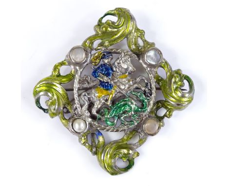 An unmarked silver, enamel and pearl George and the Dragon brooch, with pierced scrollwork settings, 52mm across, 19.8g 