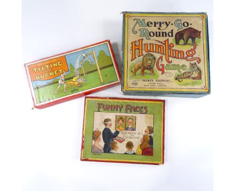 A Vintage clockwork Merry-Go-Round hunting game, a Funny Faces game, and a Tilting the Bucket game (3) 