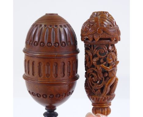 A 19th century carved coquilla nut lidded cup on ivory stand, height 13.5cm, and an ornately carved and pierced coquilla nut 