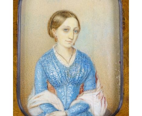 A 19th century miniature watercolour portrait of a lady, unsigned, in original walnut and ebonised frame, overall height 15cm