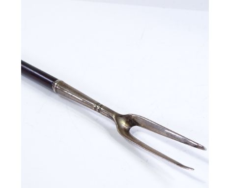 A rare Charles II silver-mounted toasting fork, circa 1670, with turned wood handle (possibly laburnum), with central silver 