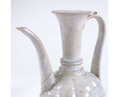 A Chinese white glaze porcelain ewer, collection label under base, height 28cm 