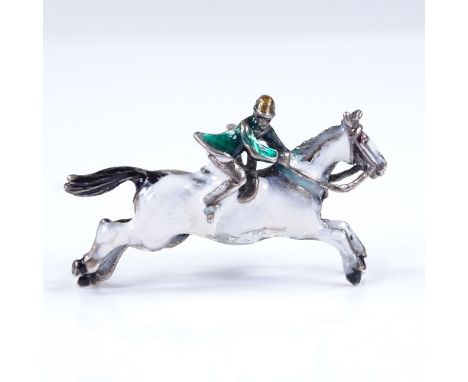 An unmarked silver and enamel jockey pendant/brooch, 35.6mm across, 6.1g 