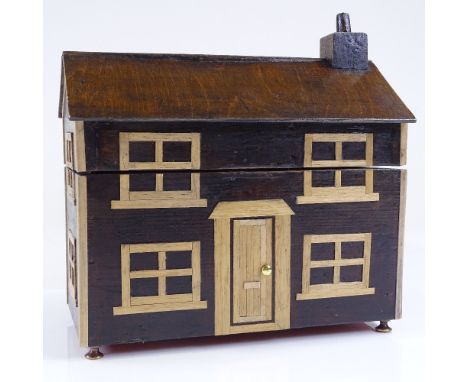 An Arts and Crafts stained wood cottage design tea caddy, length 24cm 