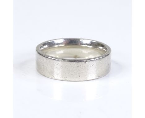 A 9ct white gold plain wedding band ring, maker's marks CPM, band width 6.2mm, size Q, 8.3g 