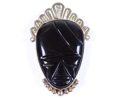 A Mexican sterling silver and onyx mask brooch, height 69.7mm, 32.7g 