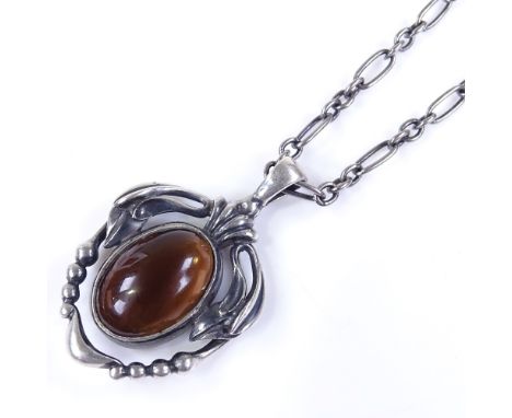 A Georg Jensen Danish sterling silver and brown stone pendant necklace, model no. 2014, pendant height 29mm, chain length 45c