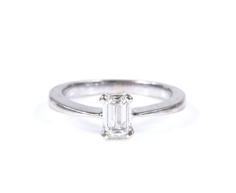 A 0.52ct emerald-cut solitaire diamond ring, unmarked settings test as platinum, setting height 6.3mm, size J, 3.3g 