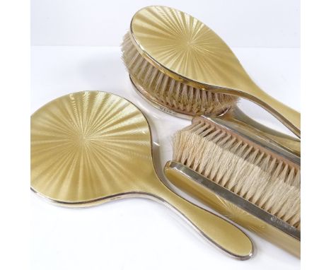 A 5-piece silver and yellow enamel dressing table set, by Goldsmiths &amp; Silversmiths Co Ltd, hallmarks London 1952 