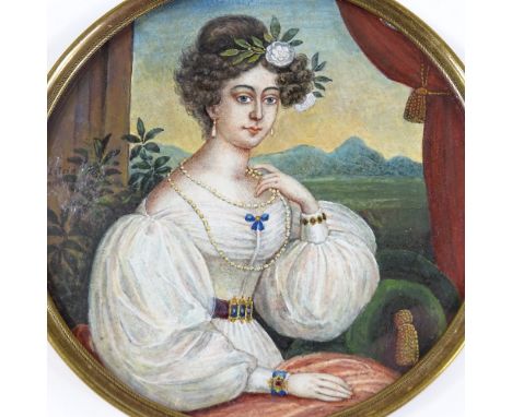 An early 19th century miniature watercolour portrait of a lady, by Vogel Von Vogelstein, brass frame, diameter 12cm 