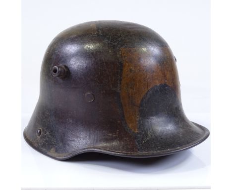 A German 1st war period military M17 camouflage tin helmet 