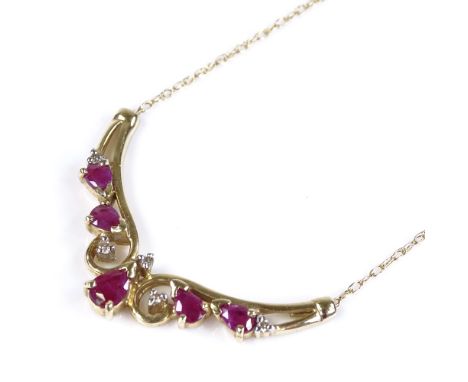 A 9ct gold ruby and diamond pendant necklace, on 9ct chain, pendant 33.9mm across, necklace length 45cm, 3g 
