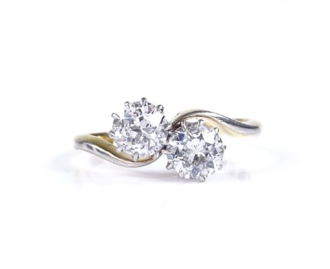 An 18ct gold 2-stone diamond crossover ring, each diamond approx 0.75ct, total diamond content approx 1.5ct, platinum-topped 