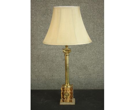 A 20th century Italian marble and brass Corinthian column table lamp, the marble base with a brass roundel depicting a Roman 