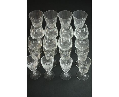 A collection of twenty alcohol glasses, including a set of six hand cut crystal brandy glasses, a set of four hand cut crysta