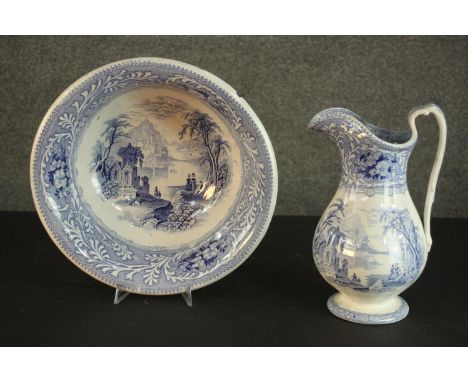 A Victorian Staffordshire blue and white china wash jug and basin, transfer printed with fantastical landscapes. H.30 W.19 D.