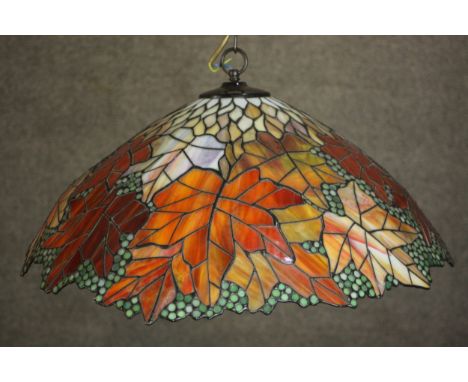A replica Tiffany style hanging lamp, decorated with maple leaves. L.55 Dia.51cm. 