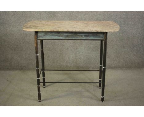 A continental side table. with a marble top, on a bronze base with cylindrical legs joined by stretchers. H.92 W.109 D.45cm. 