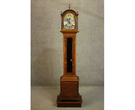 A 20th century 'Warmink' (Dutch) Grandmother long case clock, veneered in burr walnut. The brass and steel dial with Bacchic 