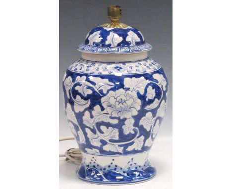A modern hand-painted blue and white baluster lamp, with floral decoration 36cm high