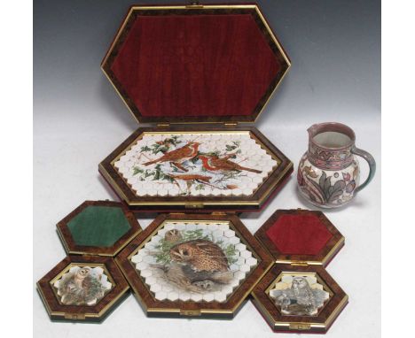 Four James Peters of Worcester porcelain mosaic tiles in fitted presentation boxes and a Charlotte Rhead Bursley Ware jug, 13