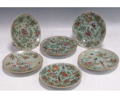 A set of six 19th century Canton enamel celadon ground plates, decorated with blossoms, butterflies and pomegranates, two wit