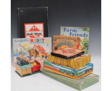 Linemat Toys, a tinplate battery operated typist, a Brimtoy tinplate clockwork trainset, boxed, another un-named, a War time 