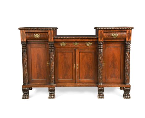 A Georgian Neo-classical mahogany carved sideboard attributed to Duncan Phyfe, New York circa 1820, the gadrooned carved edge