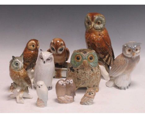 Three Karl Ens porcelain owls, a Zsolnay Pecs owl seated upon a book with quill, a Royal Copenhagen model of an owl (glued ea