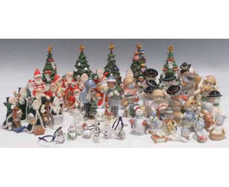 A large collection of Royal Copenhagen porcelain Christmas figures, to include Annual Santa Series, Goebel snowmen, Nao snowm